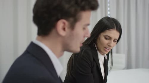 Professional Man and Woman Having a Business Conversation