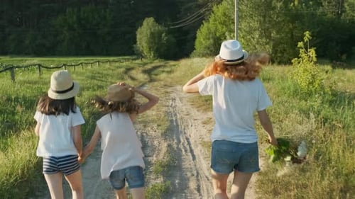 Children Three Girls in Hats Holding Hands Running Back Along Rural Country Road