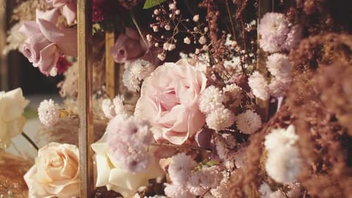 Closeup View of Wedding Floral Decorations of Flowers in Pastel Faded Colors Slow Motion Outside