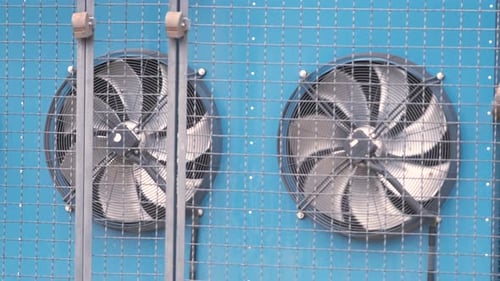Air Compressor Unit for Climate Control System of Industrial Building with Rotating Ventilation Fans