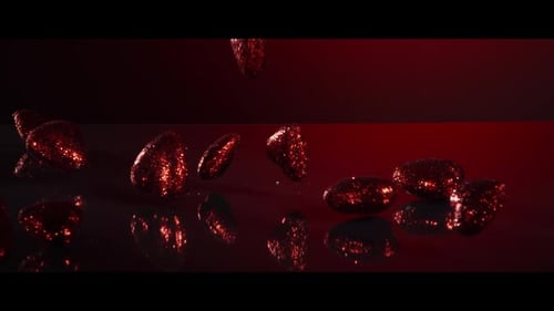 Valentine's Day decorations falling and bouncing on a reflective surface - VALENTINES 008