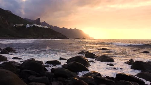 Ocean Waves Crash on Rocks in Sunset Light Playa Benijo Beach Tenerife Canary