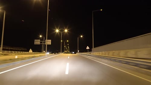 Night Drive Along Illuminated Urban Highway