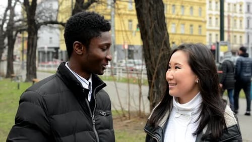 Happy Couple Talk (Conversation) - Black Man and Asian Woman - Urban Street with Cars - City