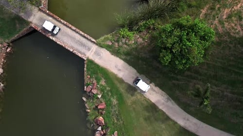 4K Aerial view group of Asian people golfing on at golf course in summer sunny day.