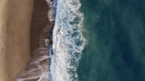 Relaxing View of Ocean Waves on Sandy Beach