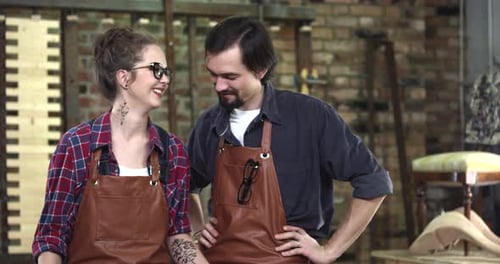 Craftspeople Smile Together in Workshop