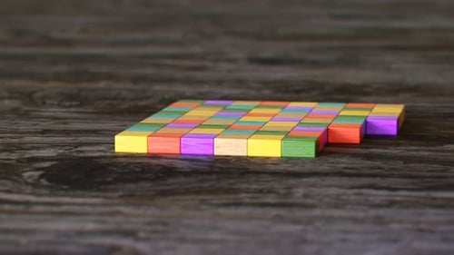 Colorful Wooden Building Blocks Constructing a House