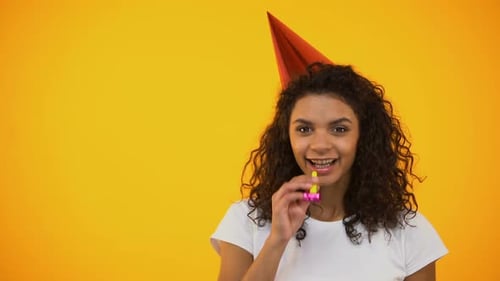 Young Woman Celebrates with Party Favor