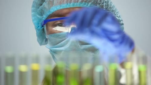 Biologist Checking Plant Samples in Test Tubes, Pesticides Influence Agriculture
