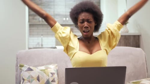 Woman Stretching at Home with Laptop
