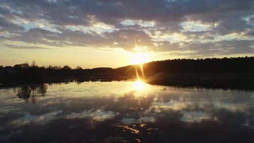 Beautiful Sunset Above the Wild Swamp and Forest