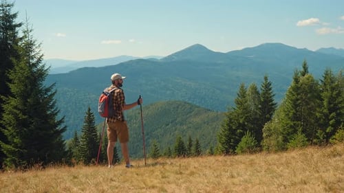 Hiker Enjoying Mountain Vista on Sunny Day