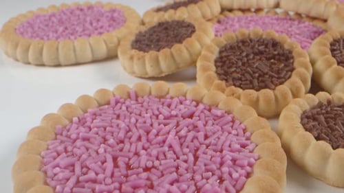 Delicious Jam-Filled Cookies with Colorful Sprinkles