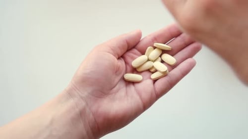Pills Dispensed into Palm of Hand, Close Up