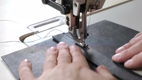 Close-up Shot of Sewing Machine in Process. Item of Clothing, Bag, Vintage Style. Sewing in Phase of