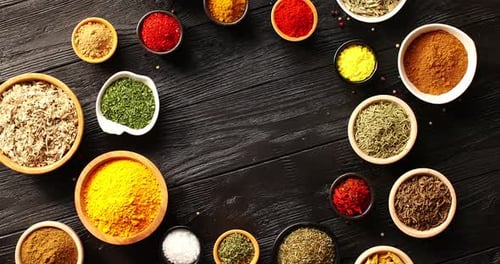 Various Colorful Herbs and Spices in Bowls