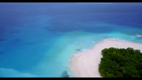 Aerial view panorama of tranquil seashore beach time by blue green ocean and clean sandy background