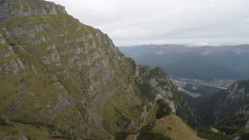 Dramatic Aerial View of Green Mountains and Valley