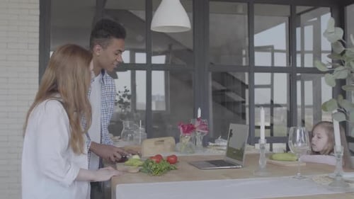 Family Cooking Vegetables Together at Home
