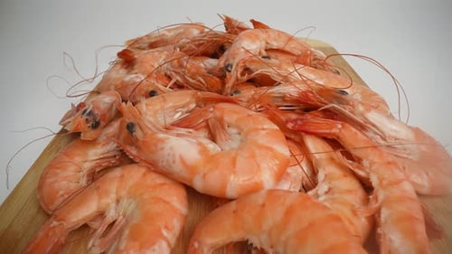Close Up of Cooked Prawns on Wooden Board