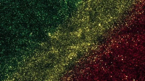 Glittering Green Yellow Red Particles Festive Background
