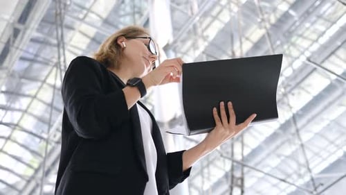 Woman in Blazer Video Conferencing with Laptop