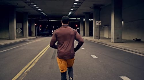 Athletic Male Running Through A Tunnel