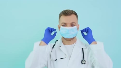 Medical Professional Putting on Surgical Mask