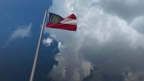Realistic Waving Georgia State Flag in Cloudy Sky