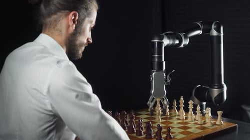 Man Plays Chess Against a Robotic Arm