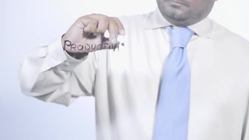 Man Writing the Word Productivity on Invisible Surface