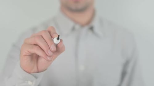 Man Writes the Word Proud on Clear Surface