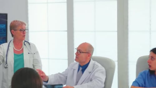 Medical Professionals Meeting to Review Brain Scans