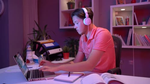 Young Adult Studies at Desk with Laptop