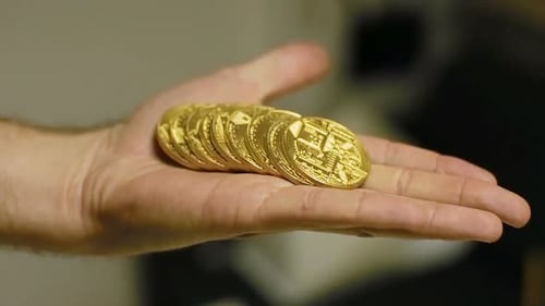 Slow Motion Man Tosses Coins in Hand Created As Bitcoin Currency