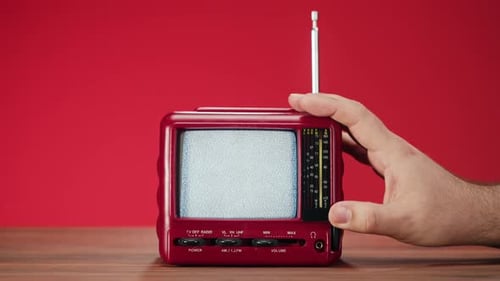 Vintage Red Television with Static on Screen