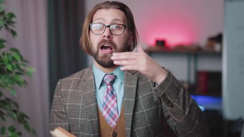 Man Explaining with Book and Gestures