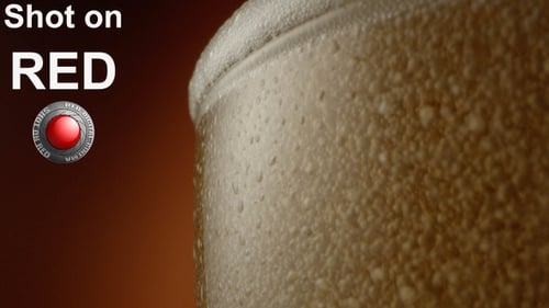 Froth Beer Pouring Out From A Glass A Macro Shot On Red Epic With Terra Cotta Background