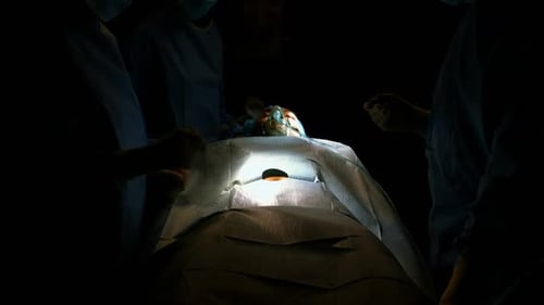 Surgery Performed by a Medical Team at Night