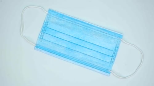 Close Up of Light Blue Surgical Mask