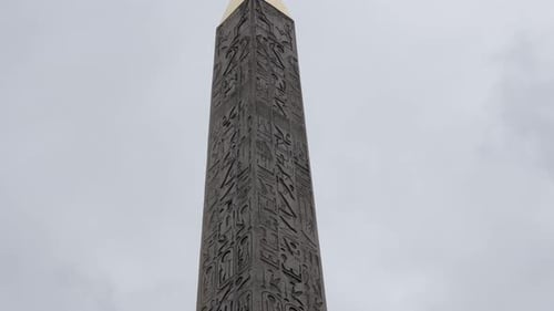 Granite Luxor Obelisk on Concorde square in French capital Paris slow tilt 4K 2160p UltraHD footage