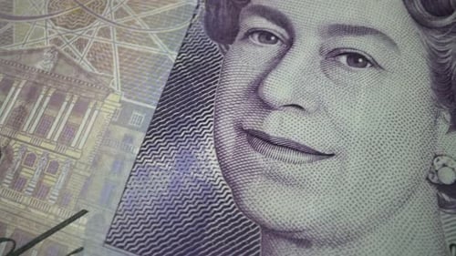 Fifty British Pound paper banknote in close up macro view dolly shot.