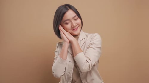 Woman Yawns and Mimics Sleeping