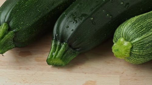 Fresh Green Zucchini on Wooden Cutting Board