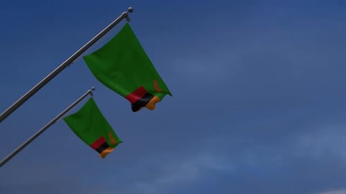Zambian Flags Waving Against Blue Sky