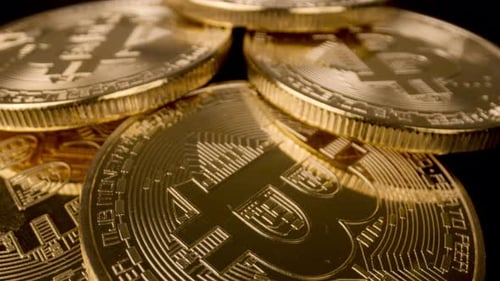Pile of Gold Bitcoin Cryptocurrency Coins Close Up