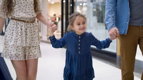 Video of happy little girl during shopping at the mall. Shot with RED helium camera in 8K.