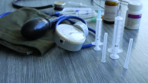 Medical Devices, Sphygmomanometer and Syringes, Close Up