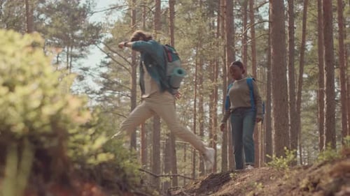 Multiethnic Couple Hiking in Forest